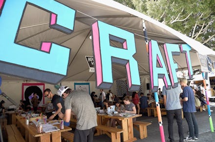 A stand at a fair that says Craft in large 3d letters at the entrance to the tent