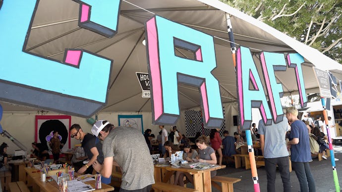 A stand at a fair that says Craft in large 3d letters at the entrance to the tent