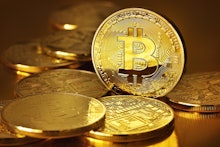 A pile of golden Bitcoin coins