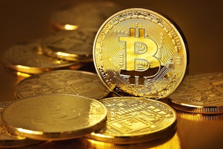 A pile of golden Bitcoin coins