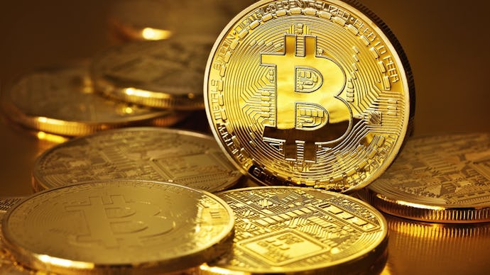 A pile of golden Bitcoin coins