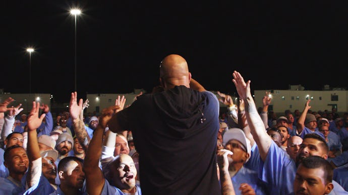 The rapper Common performing in one of the prisons on his prison concert tour