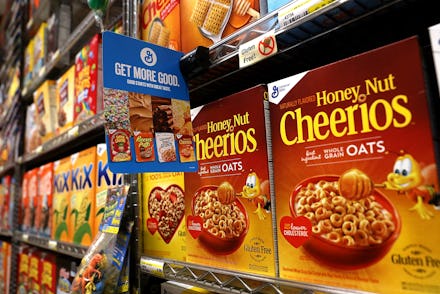 Shelves in a store with Cheerios on them