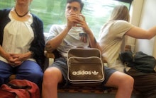 Manspreader spreading during a Subway ride