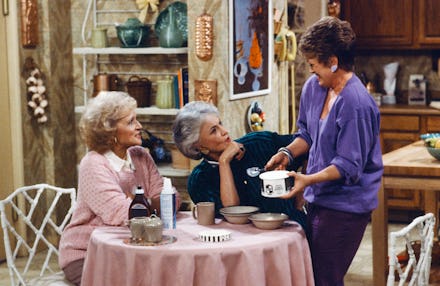 Rose, Dorothy, and Blanche having coffee in a scene from the 'Golden Girls.'