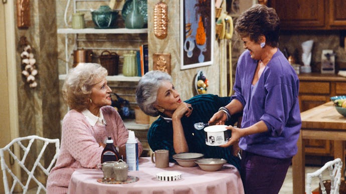 Rose, Dorothy, and Blanche having coffee in a scene from the 'Golden Girls.'