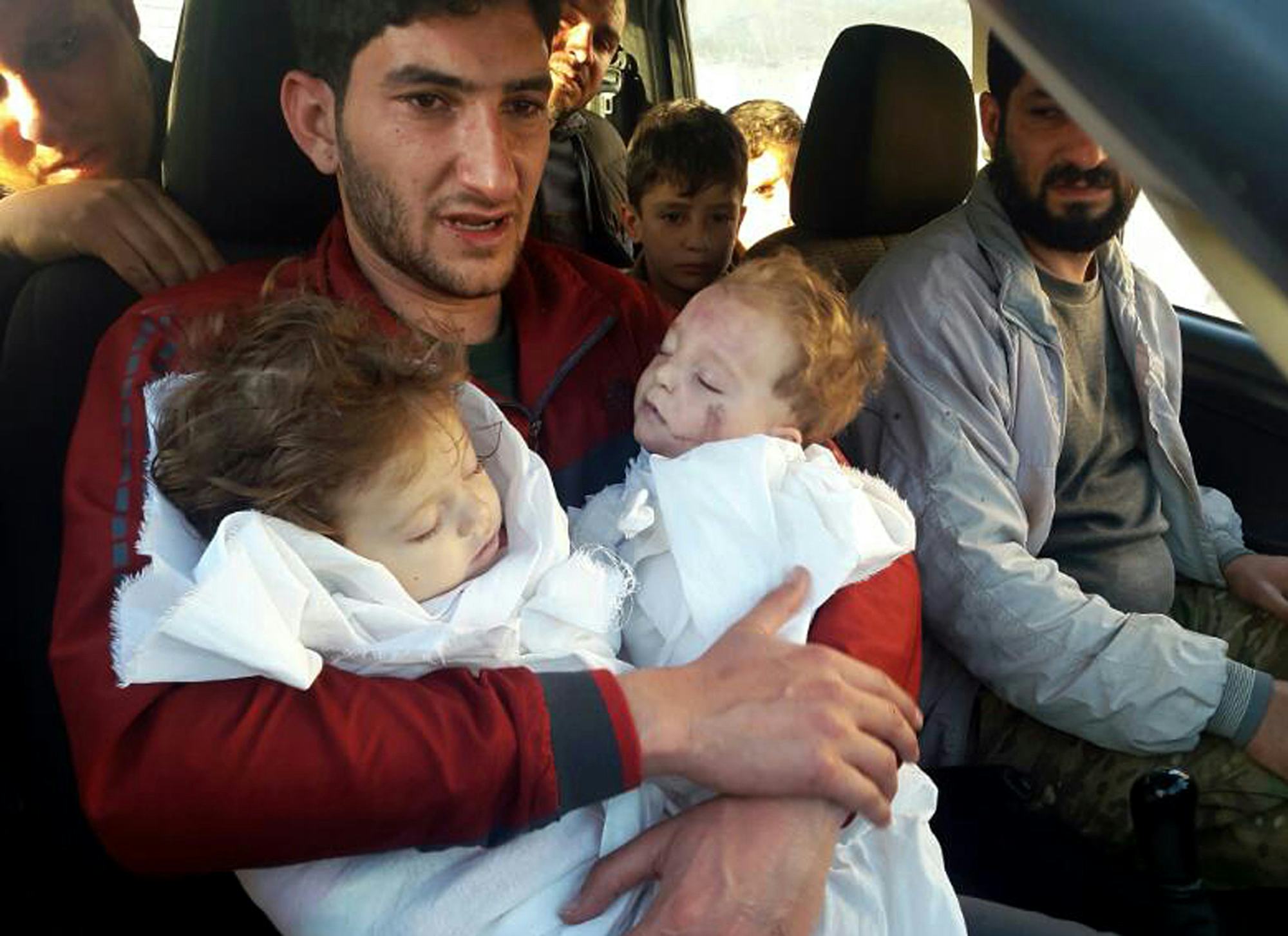 Tragic Video Shows A Syrian Father Burying Twin Toddlers Killed In ...