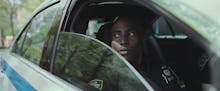 John David Washington in 'Monsters and Men' looking through a car window