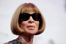 Anna Wintour posing in sunglasses at a red carpet event