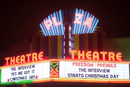 The plaza theatre with ads for the interview starting on christmas day