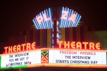 The plaza theatre with ads for the interview starting on christmas day