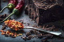 Pepper and chili on a plate with chocolate