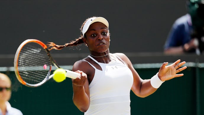 Sloane Stephens, a US Olympic tennis player, in a white dress, and a white cap during a match