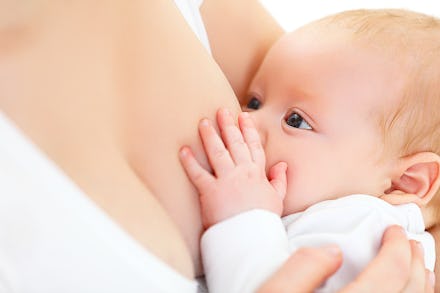A woman breastfeeding her newborn baby