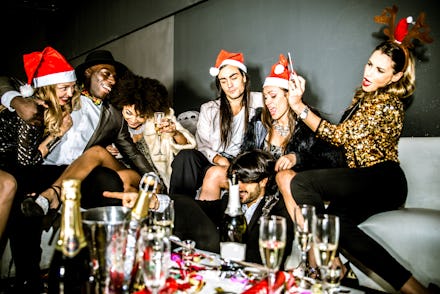Six colleagues drinking champagne at an office holiday party