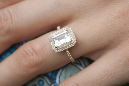 A close-up of a woman's hand and her large engagement ring