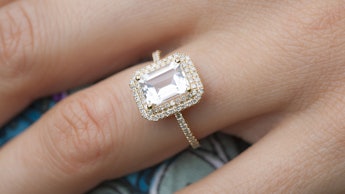 A close-up of a woman's hand and her large engagement ring
