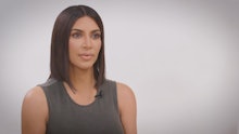 Kim Kardashian with short bob hair sitting on the chair in an interview talking about meeting Donald...