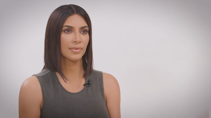 Kim Kardashian with short bob hair sitting on the chair in an interview talking about meeting Donald...