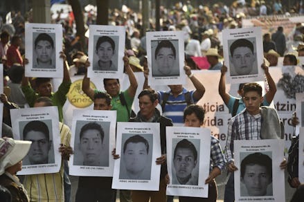 Protestors holding Pictures of 43 Missing Mexican Students 