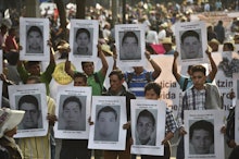 Protestors holding Pictures of 43 Missing Mexican Students 