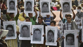 Protestors holding Pictures of 43 Missing Mexican Students 