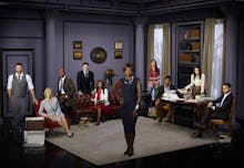 How to Get Away With Murder cast gathered around the living room set in the show 