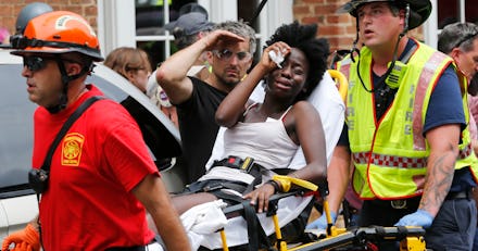 A demonstrator being carried away by ambulance workers in Charlottesville 