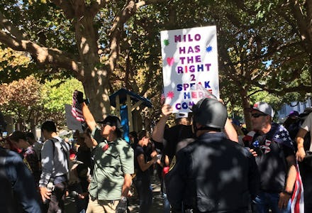Milo Yiannopoulos’ free speech rally in UC Berkeley with someone holding a sign that reads milo has ...