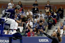 Serena Williams speaking to a judge during a match