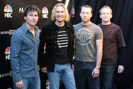 Nickelback standing next to each other during a red carpet event