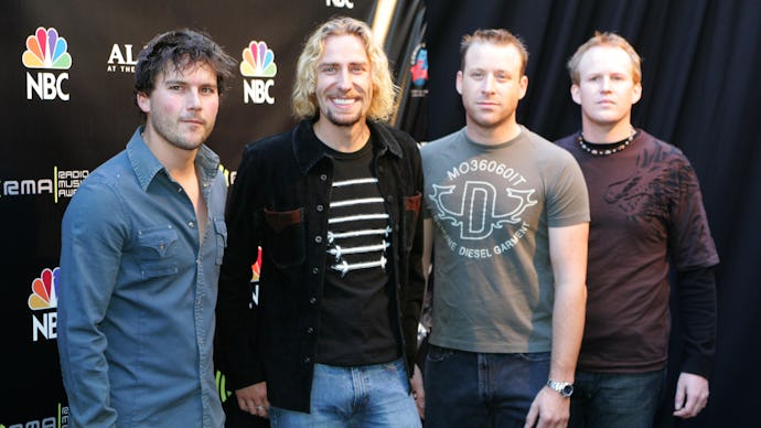 Nickelback standing next to each other during a red carpet event