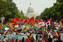 Climate activists protesting in front of the Capitol 