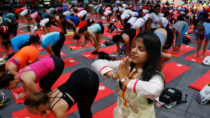 People doing Yoga in Lululemon yoga equipment and an Indian woman doing Yoga in traditional Indian y...