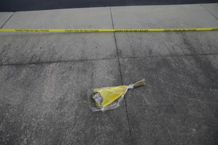 A bouquet of flowers on a concrete ground