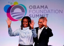 Michelle and Barack Obama waving to the audience at the obama foundation summit