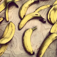 Bananas and banana peels thrown around on the floor, representing the food waste trend lately