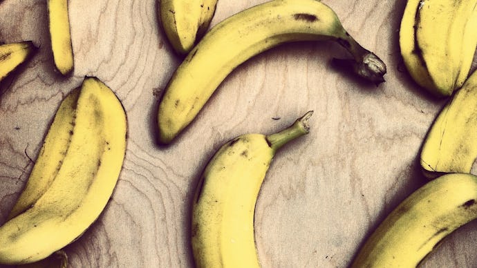 Bananas and banana peels thrown around on the floor, representing the food waste trend lately