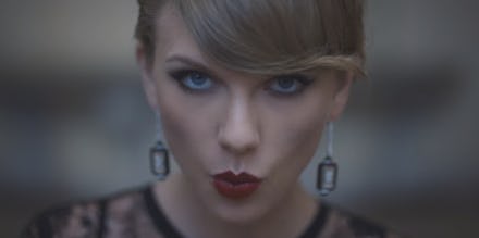 A close-up of Taylor Swift, who is very famous, and usually takes over the charts by herself.