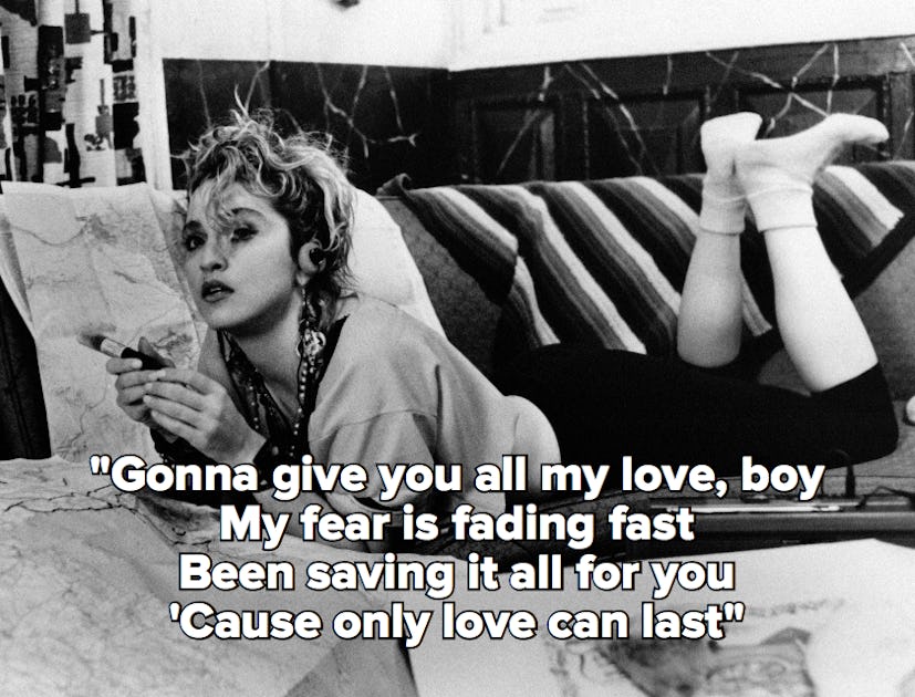 A black and white photo of Madonna laying in bed, with the lyrics to "Like a Virgin"