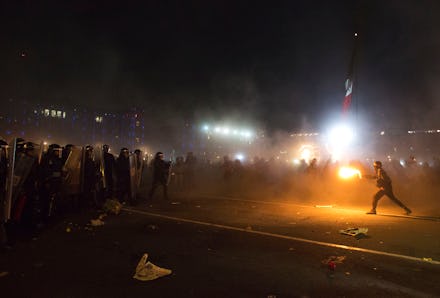 An intense photo that captured the growing protest crisis in Mexico during night time