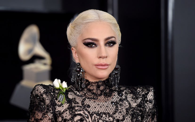 Lady gaga in a lace dress with her bleached hair and heavy black eyeshadow