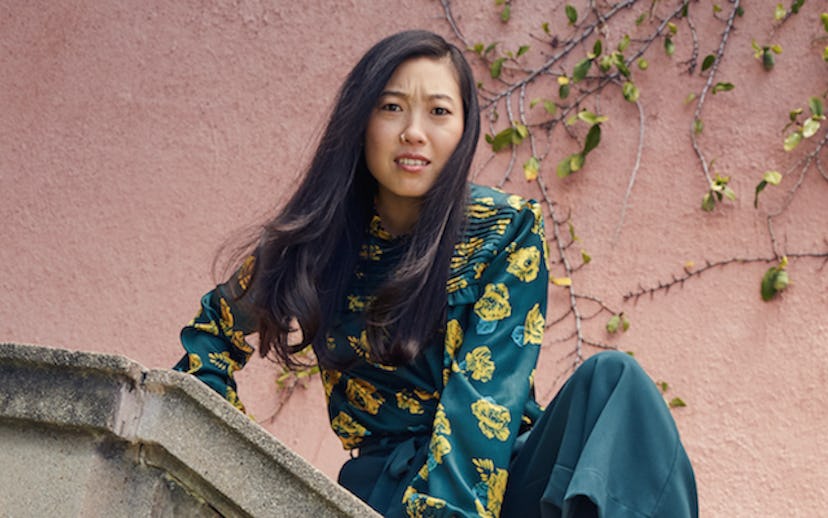 American actress and rapper Awkwafina wearing a green shirt with yellow flowers starring in ModCloth...