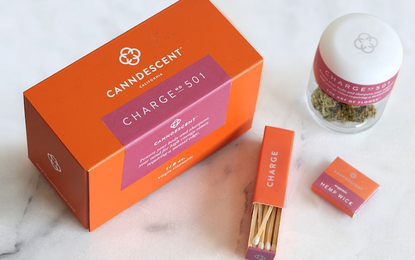 Canndescent cannabis from the "Charge" line packaged in orange and burgundy boxes 