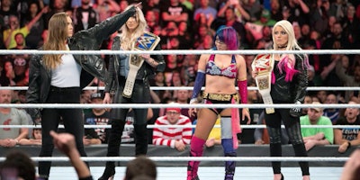 Ronda Rousey, Asuka, Charlotte Flair and Alexa Bliss standing on stage for WWE Women’s Royal Rumble