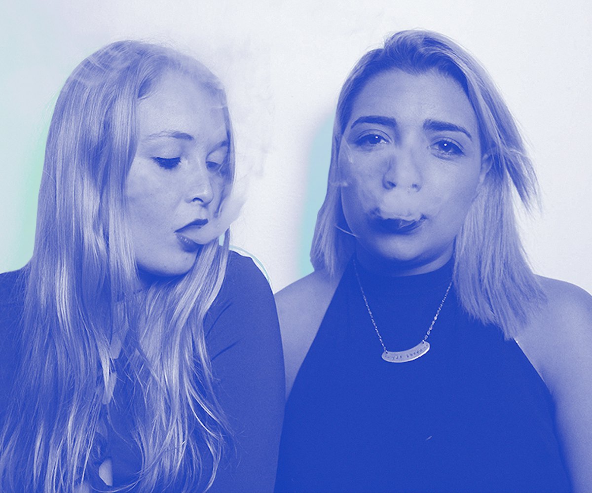 Two weed influencers smoking a blunt.
