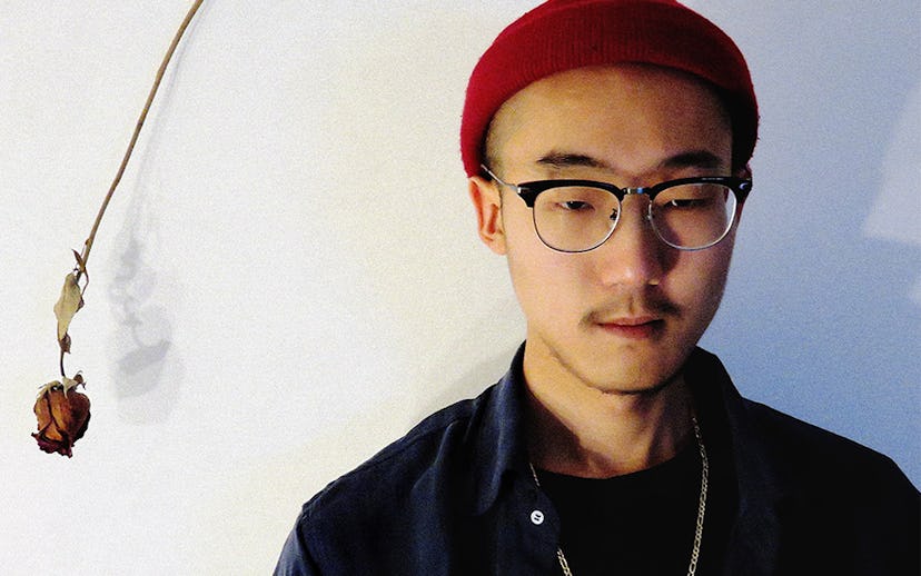 Sae Heum Han, Boston-based producer with a red beanie and a red rose next to him