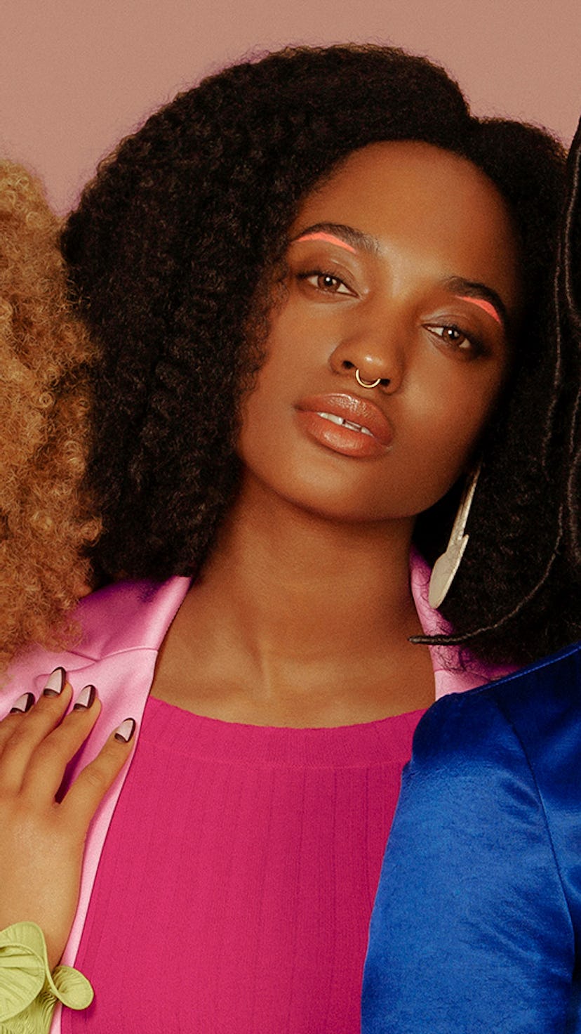 Five models dressed in navy blue, light blue, orange, pink and light green posing for NYLON's black ...