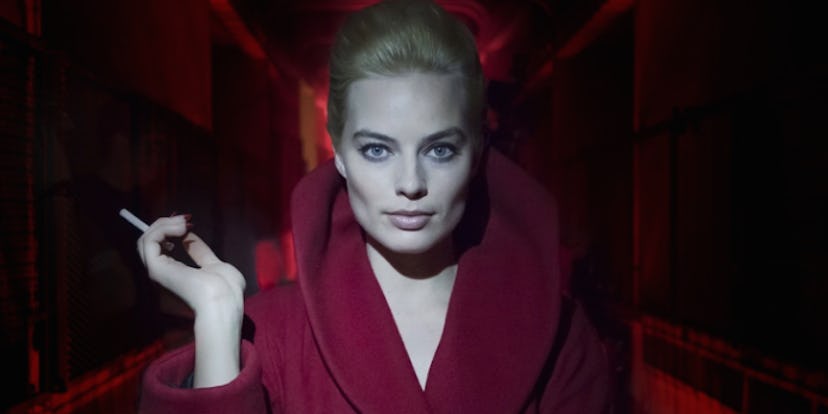 Margot Robbie posing in a red outfit for the new ‘Alice In Wonderland’ thriller