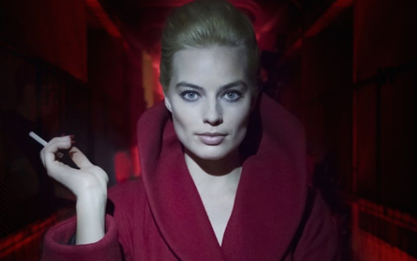 Margot Robbie posing in a red outfit for the new ‘Alice In Wonderland’ thriller